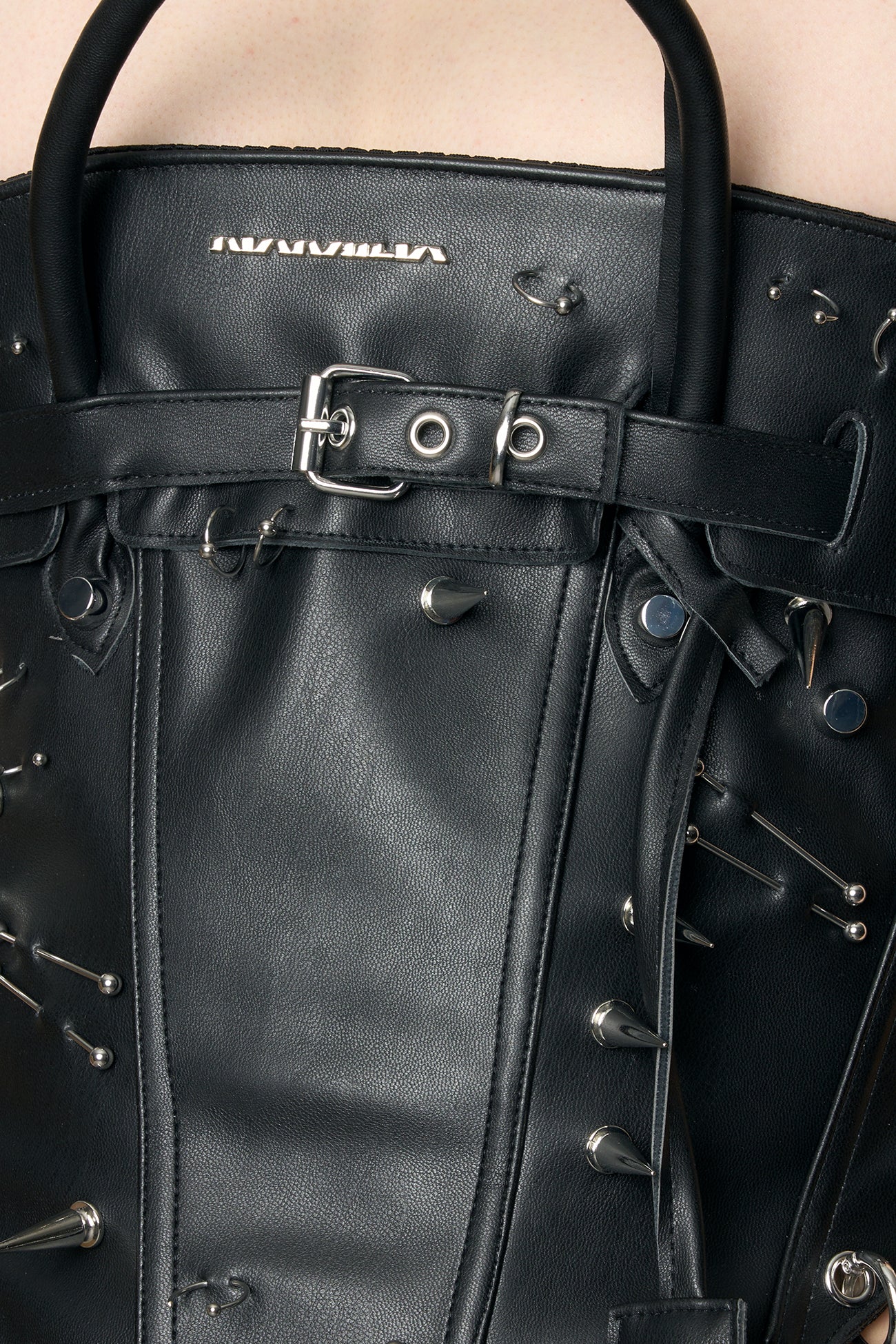 metal logo, piercing and spike detailing on front